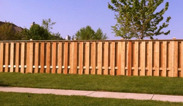 Timber Ridge Fence Company installs wood picket shadowbox fences for residents in Indiana homes.